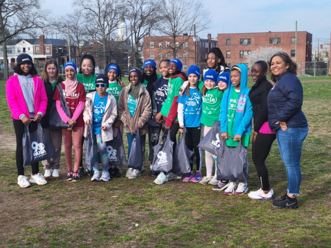 Pictured is Washington Latin Public Charter School's Heart & Sole team along with WUSA9 Reporter Allison Seymour and Executive Director, Devoria Armstead.